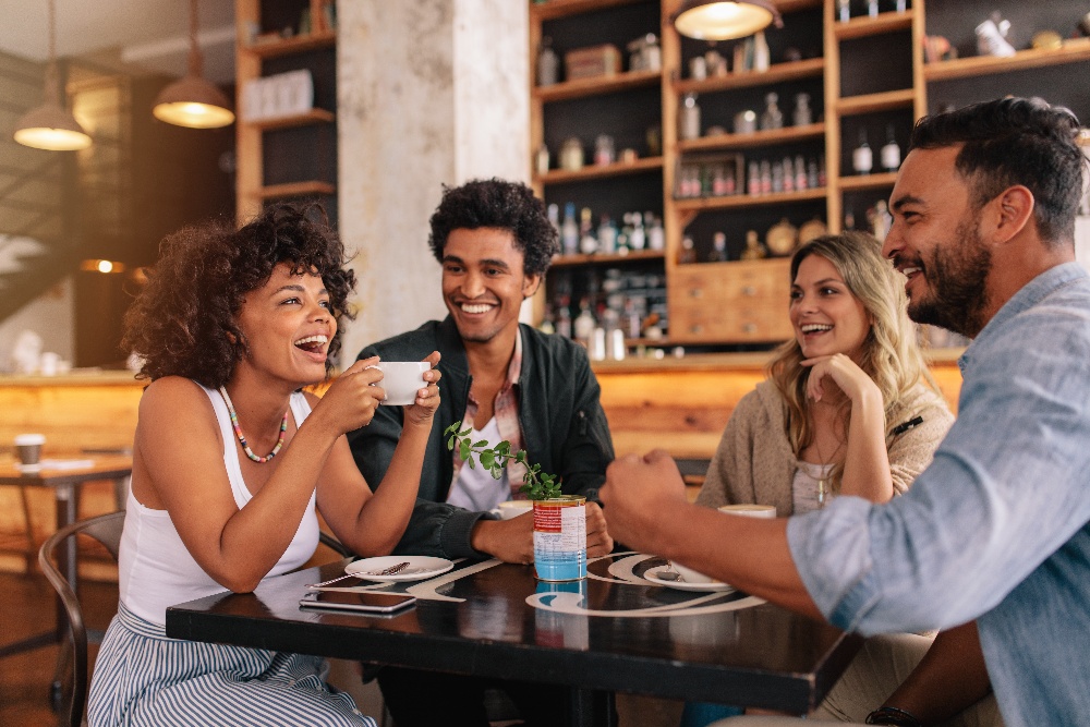 A group of friends dine together at a restaurant.